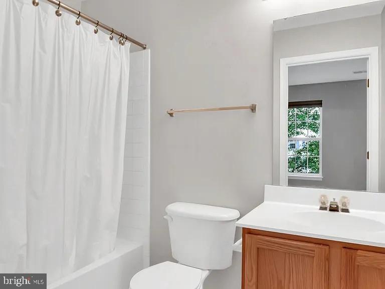 44480 Watertown Terrace Ashburn, VA 20147 - Photo 18 of 22 a bathroom with a sink a toilet and shower
