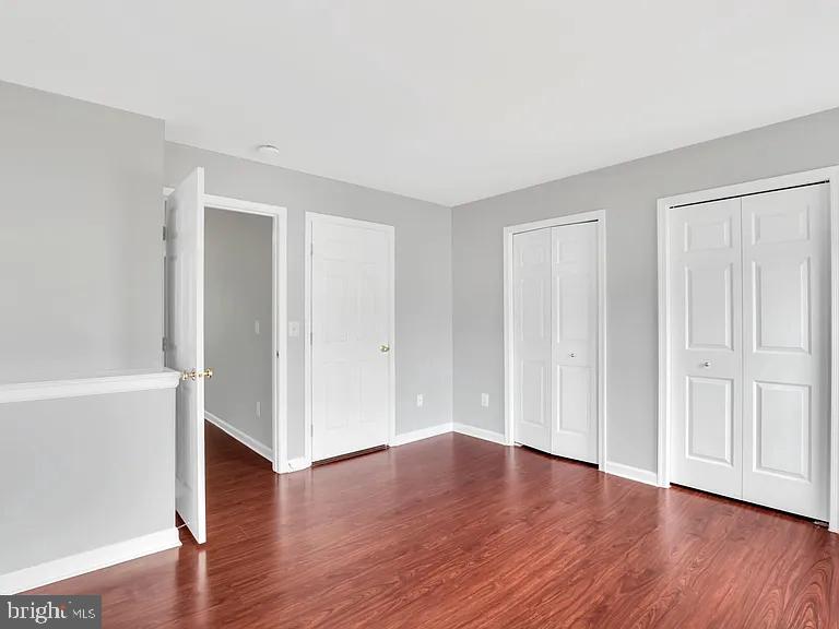 44480 Watertown Terrace Ashburn, VA 20147 - Photo 20 of 22 a view of an empty room with wooden floor