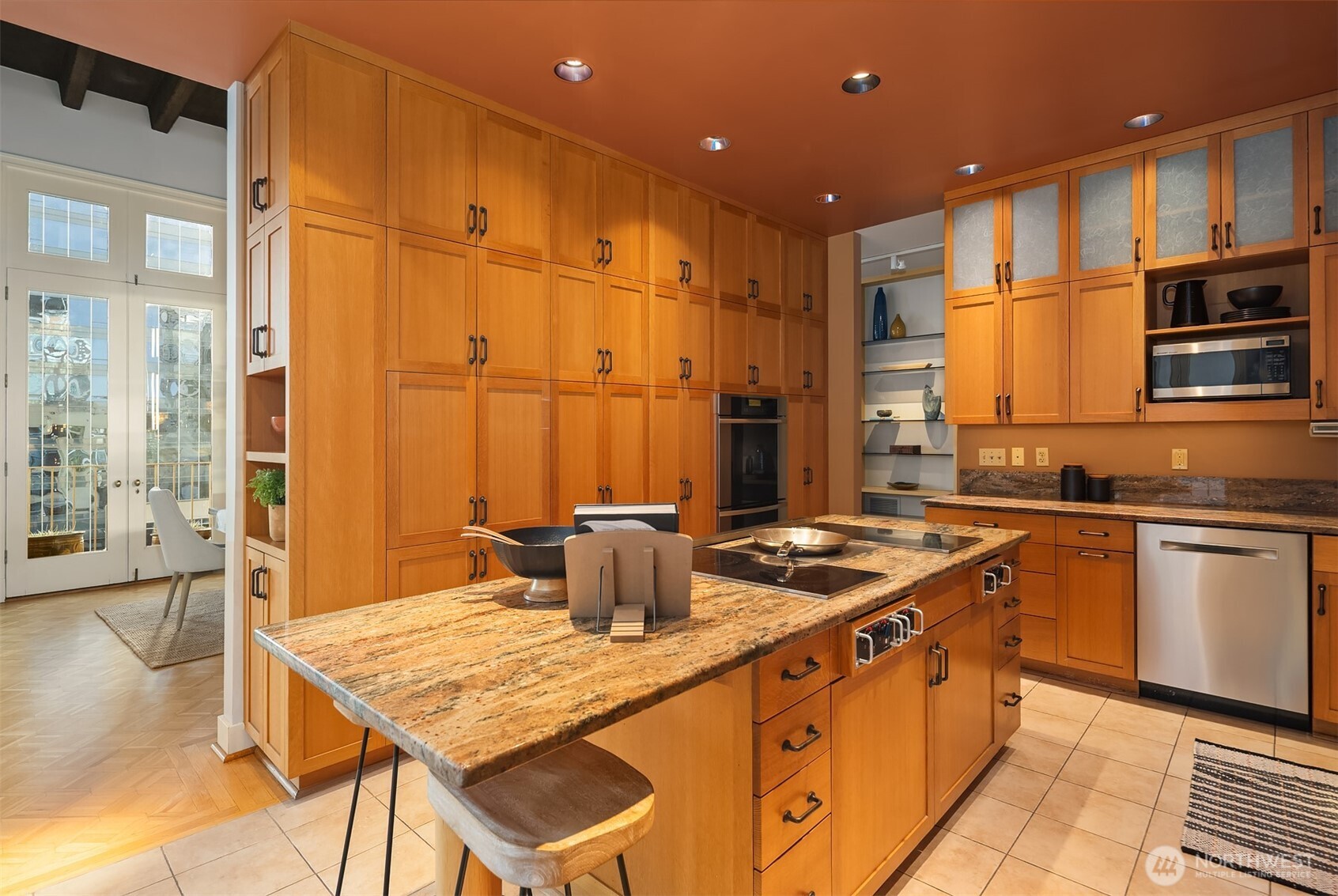 1519 3rd Avenue, Unit 801 Seattle, WA 98101 - Photo 14 of 40 a kitchen with stainless steel appliances granite countertop a sink and a stove
