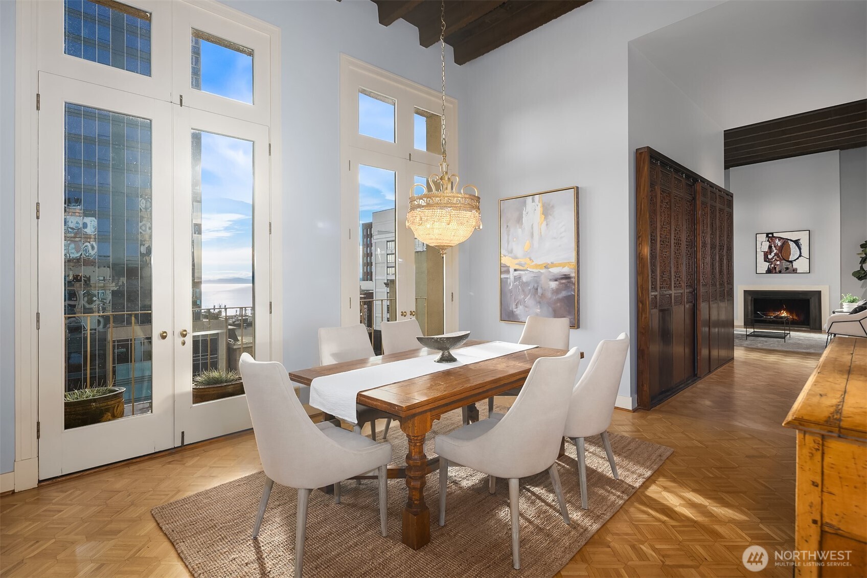 1519 3rd Avenue, Unit 801 Seattle, WA 98101 - Photo 15 of 40 a view of a dining room with furniture and a large window