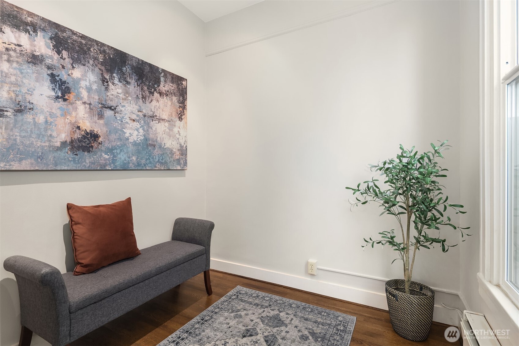 1519 3rd Avenue, Unit 801 Seattle, WA 98101 - Photo 25 of 40 a living room with furniture and a potted plant