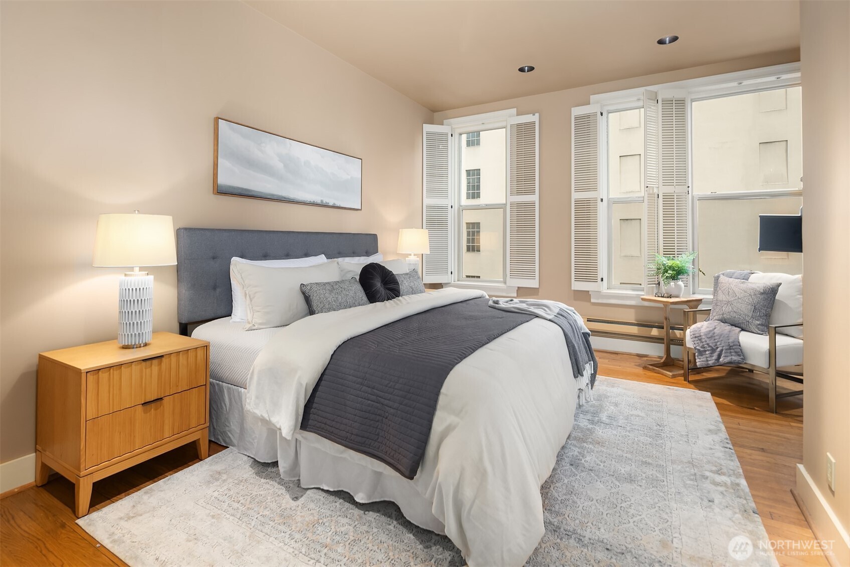 1519 3rd Avenue, Unit 801 Seattle, WA 98101 - Photo 28 of 40 a bedroom with bed and large windows