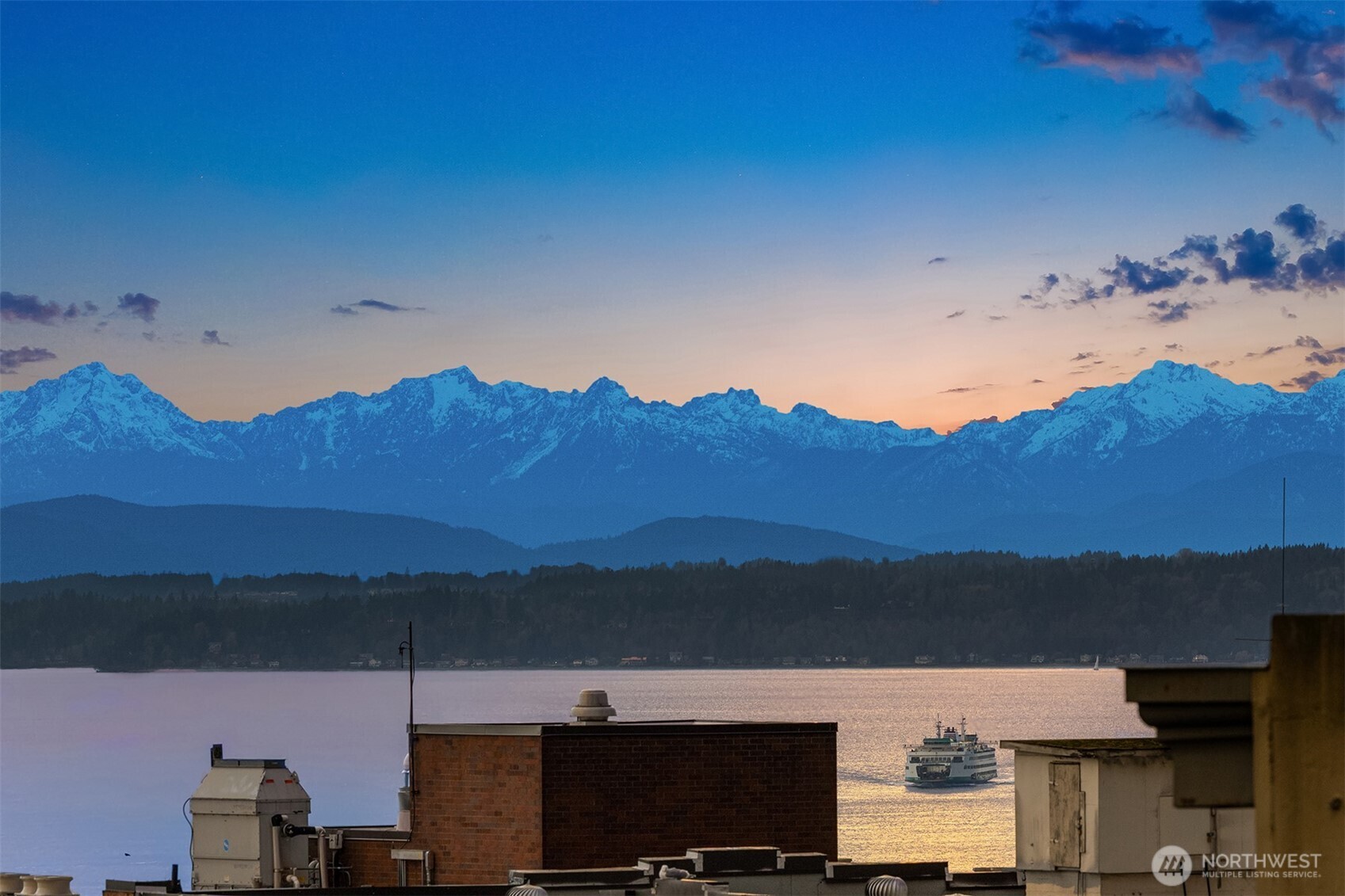 1519 3rd Avenue, Unit 801 Seattle, WA 98101 - Photo 4 of 40 a view of a city with sunset view