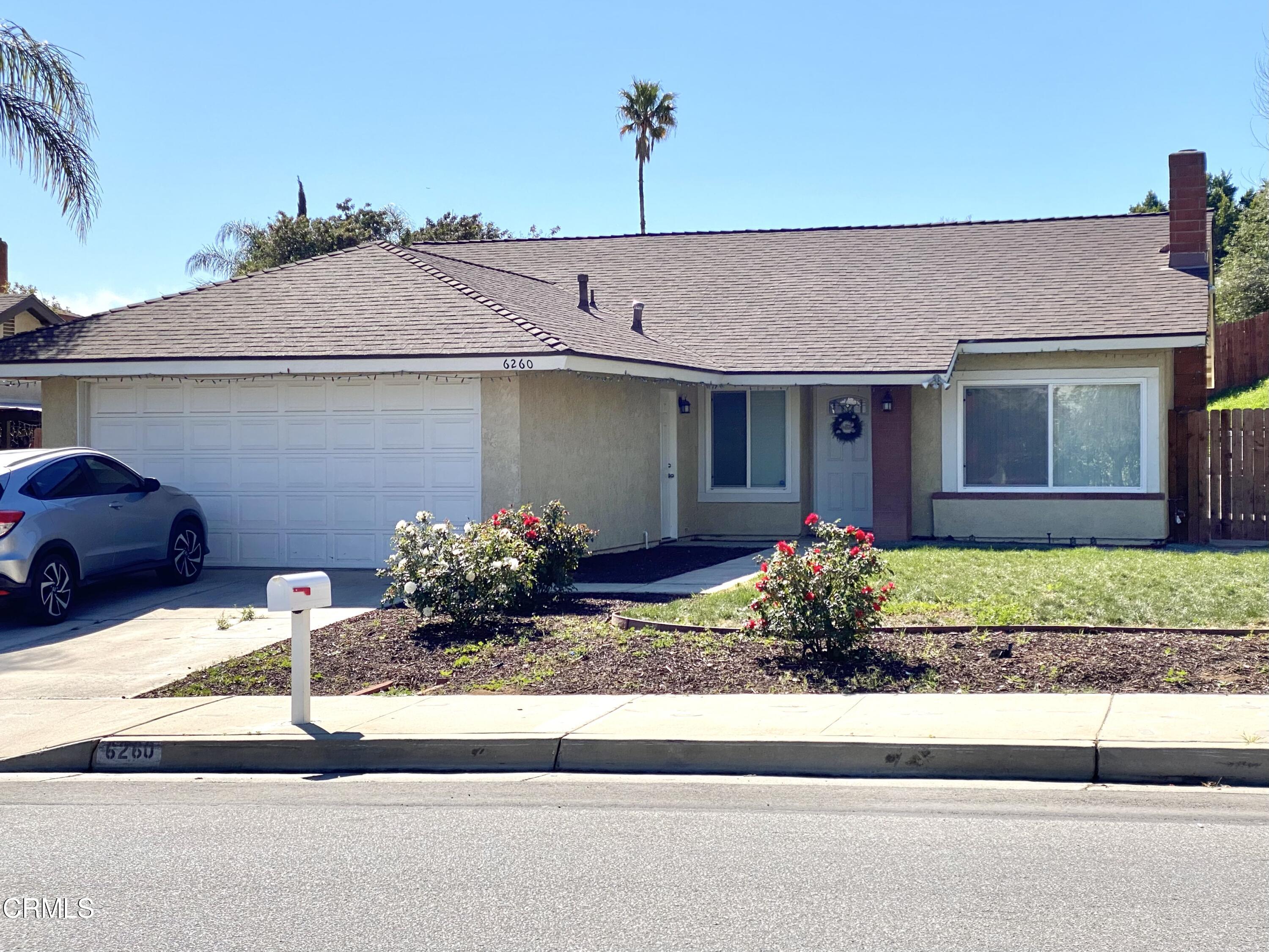 6260 45th Street Riverside, CA 92509 - Photo 1 of 18 a front view of a house with garden