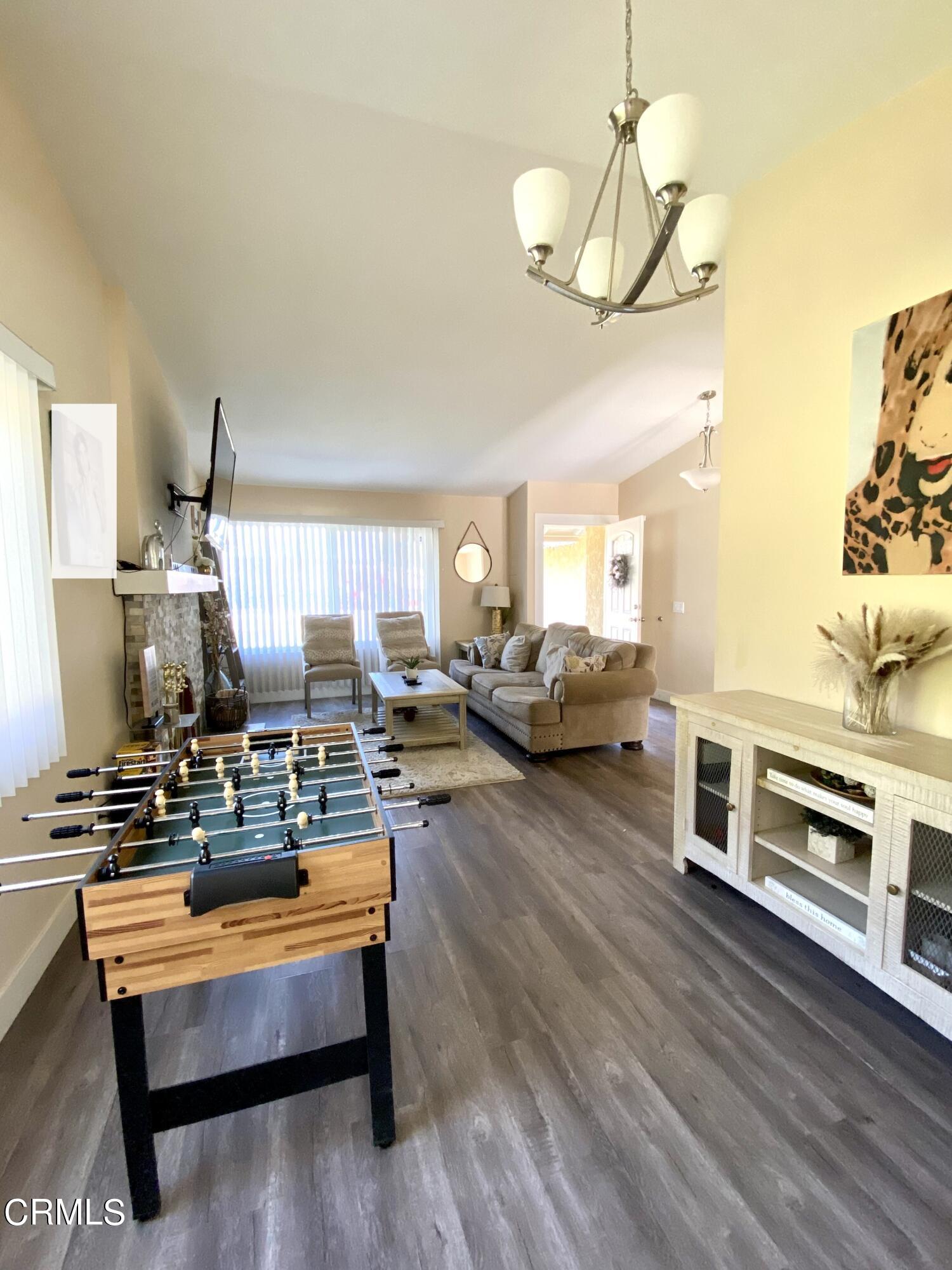 6260 45th Street Riverside, CA 92509 - Photo 5 of 18 a living room with furniture and a chandelier