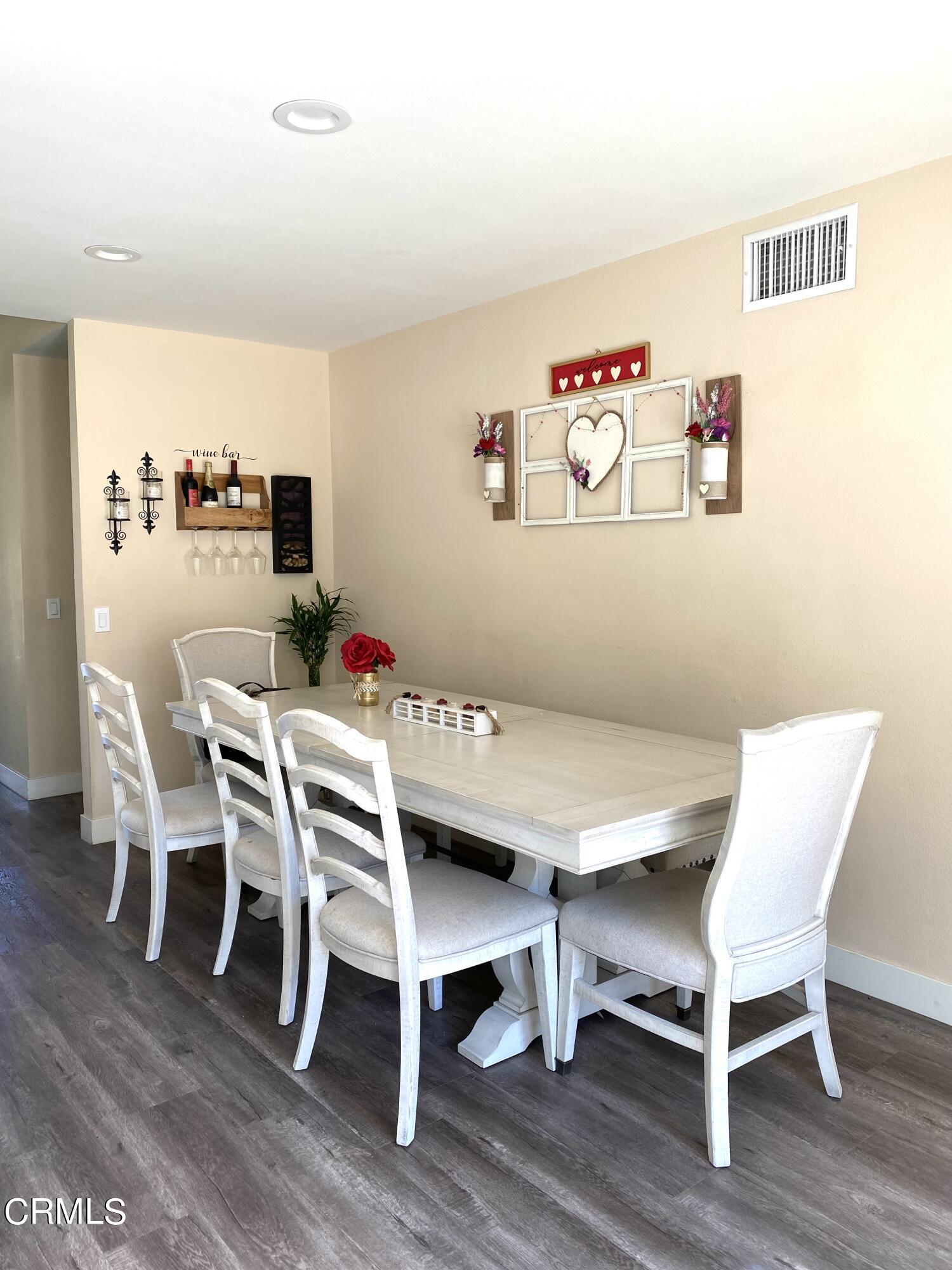 6260 45th Street Riverside, CA 92509 - Photo 7 of 18 a view of a dining room with furniture and wooden floor