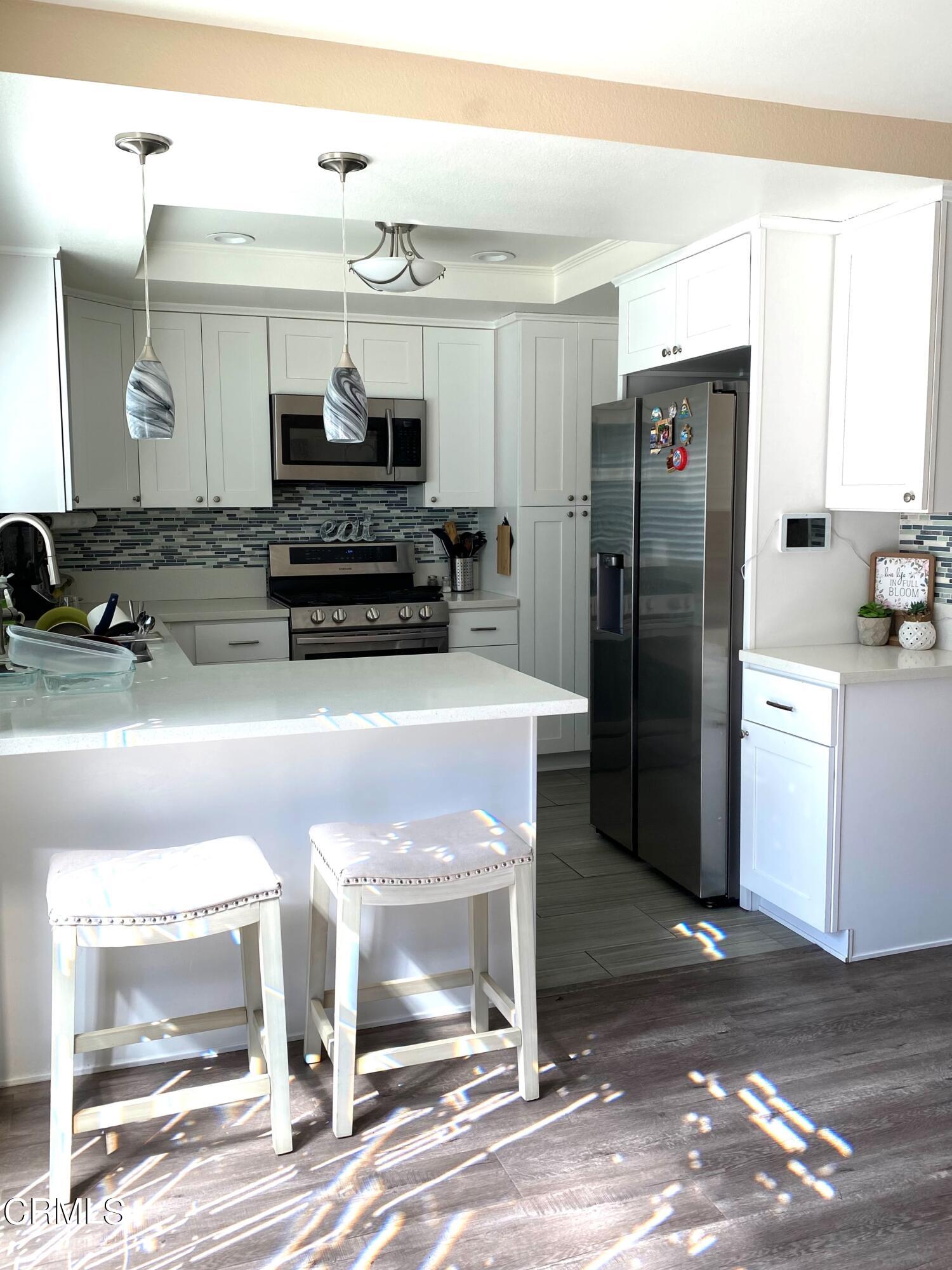 6260 45th Street Riverside, CA 92509 - Photo 8 of 18 a kitchen with refrigerator and cabinets