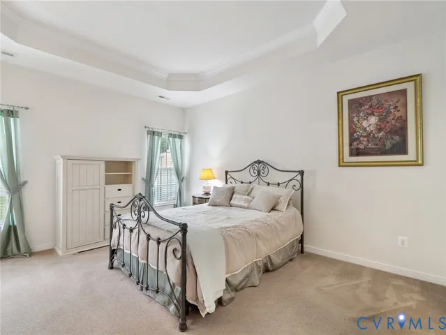 a bedroom with a bed and a table