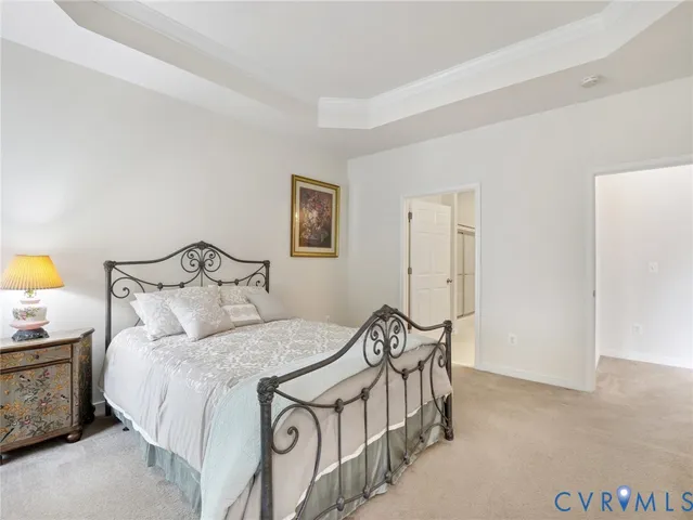 a bedroom with a bed and a table