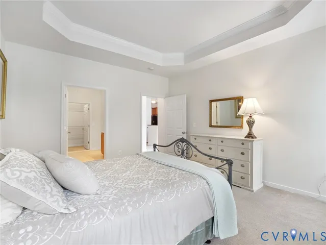 a bedroom with a bed and a lamp