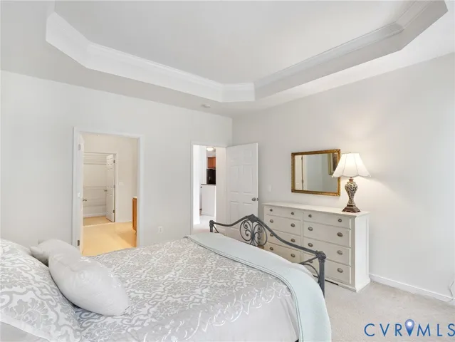 a bedroom with a bed and a lamp