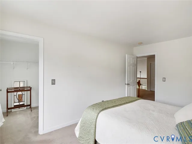 a bedroom with a bed and a chair