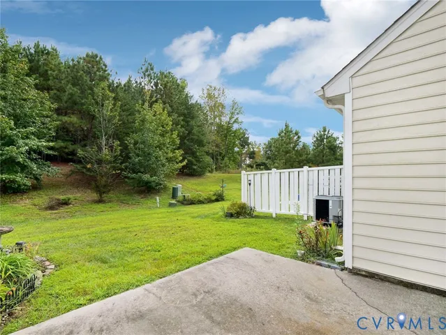 a view of a backyard with grass