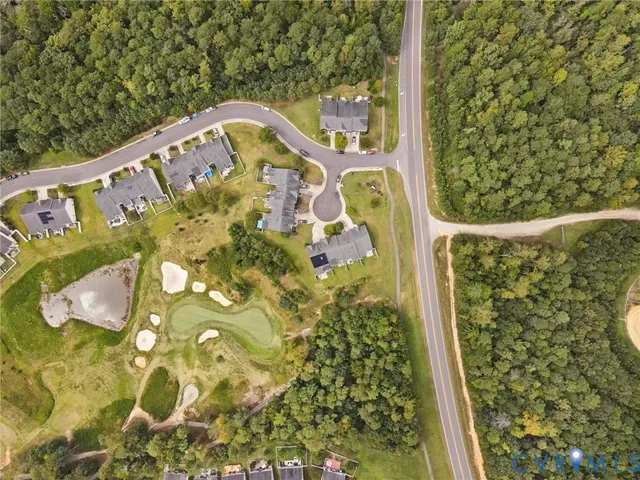 a picture of a bench in front of a white house