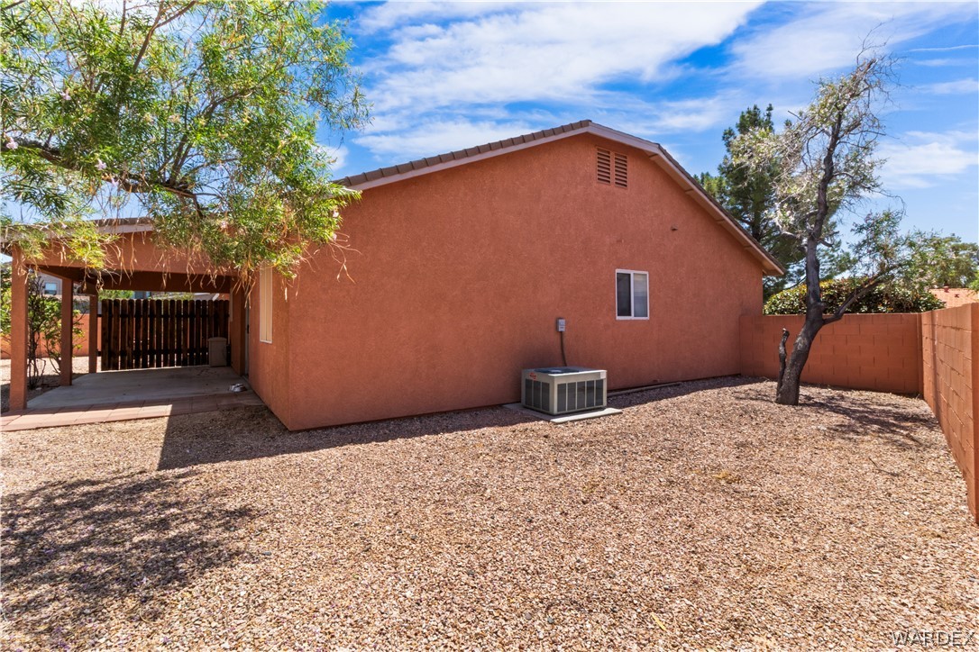 2158 Ranch Road Kingman, AZ 86401 - Photo 38 of 48 a backyard of a house with a tree