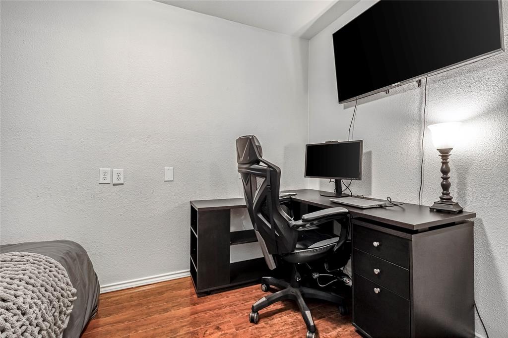 3740 Vitruvian Way, Unit D Addison, TX 75001 - Photo 18 of 22 a view of a workspace with furniture and a flat screen tv