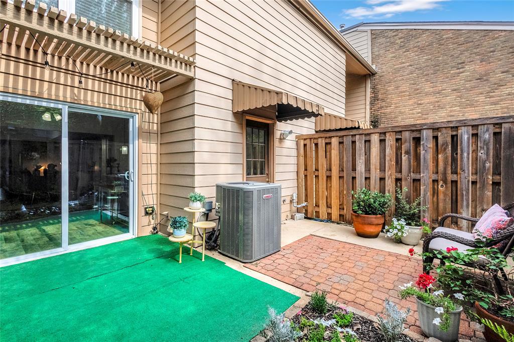 3740 Vitruvian Way, Unit D Addison, TX 75001 - Photo 21 of 22 a backyard of a house with seating space