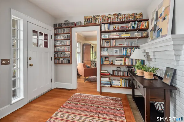 a view of a livingroom with furniture and staircase