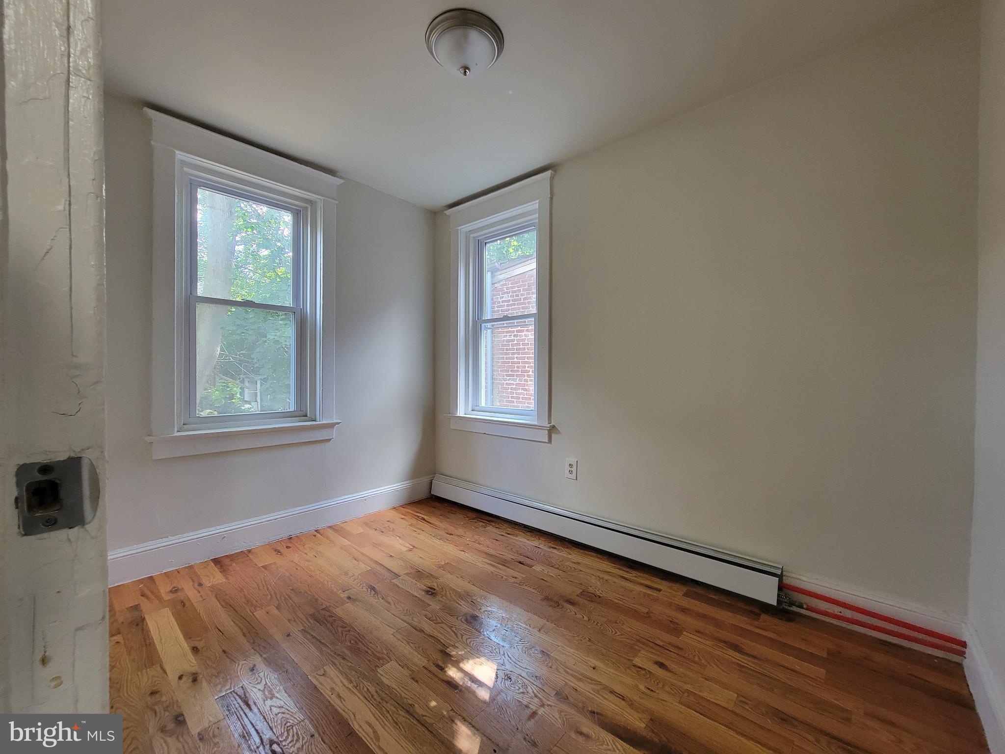 238 Rosemont Avenue Trenton, NJ 08618 - Photo 6 of 9 an empty room with windows