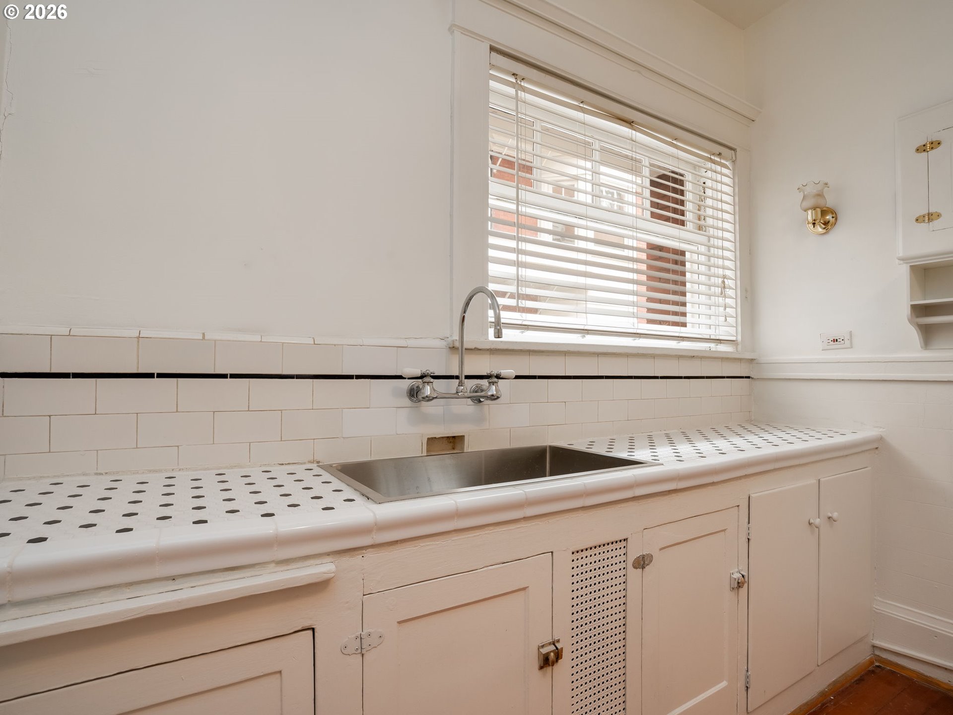 2083 Northwest Johnson Street, Unit 41 Portland, OR 97209 - Photo 18 of 25 a kitchen with a sink and cabinets