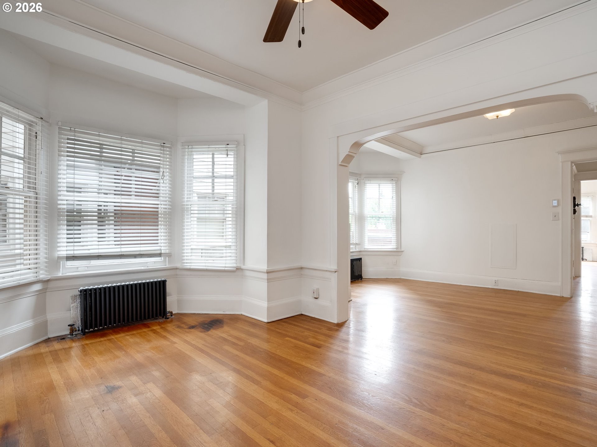 2083 Northwest Johnson Street, Unit 41 Portland, OR 97209 - Photo 23 of 25 an empty room with wooden floor and windows