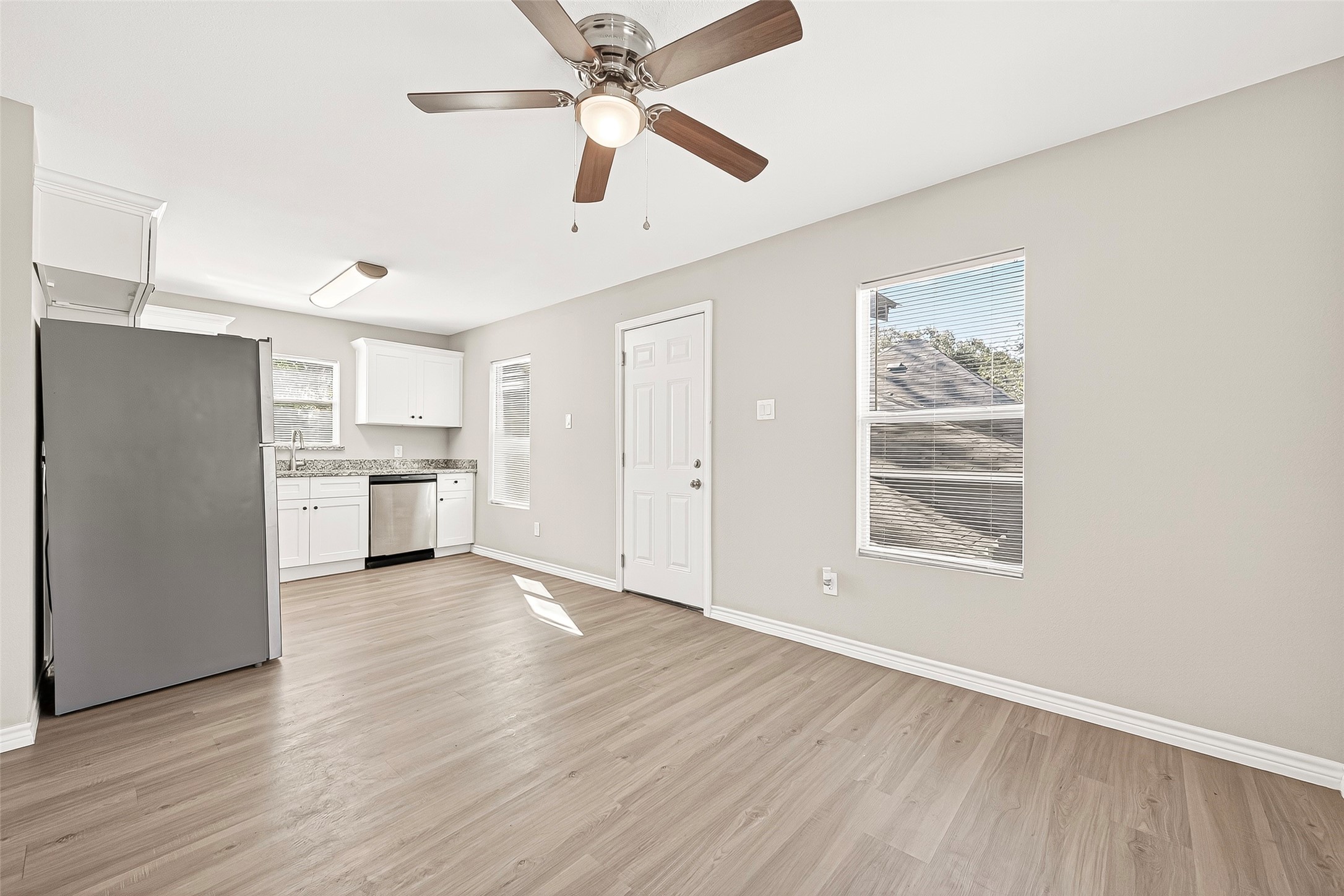 1401 5th Street Rosenberg, TX 77471 - Photo 35 of 50 Unit 210: View of front door entrance to
living room and kitchen