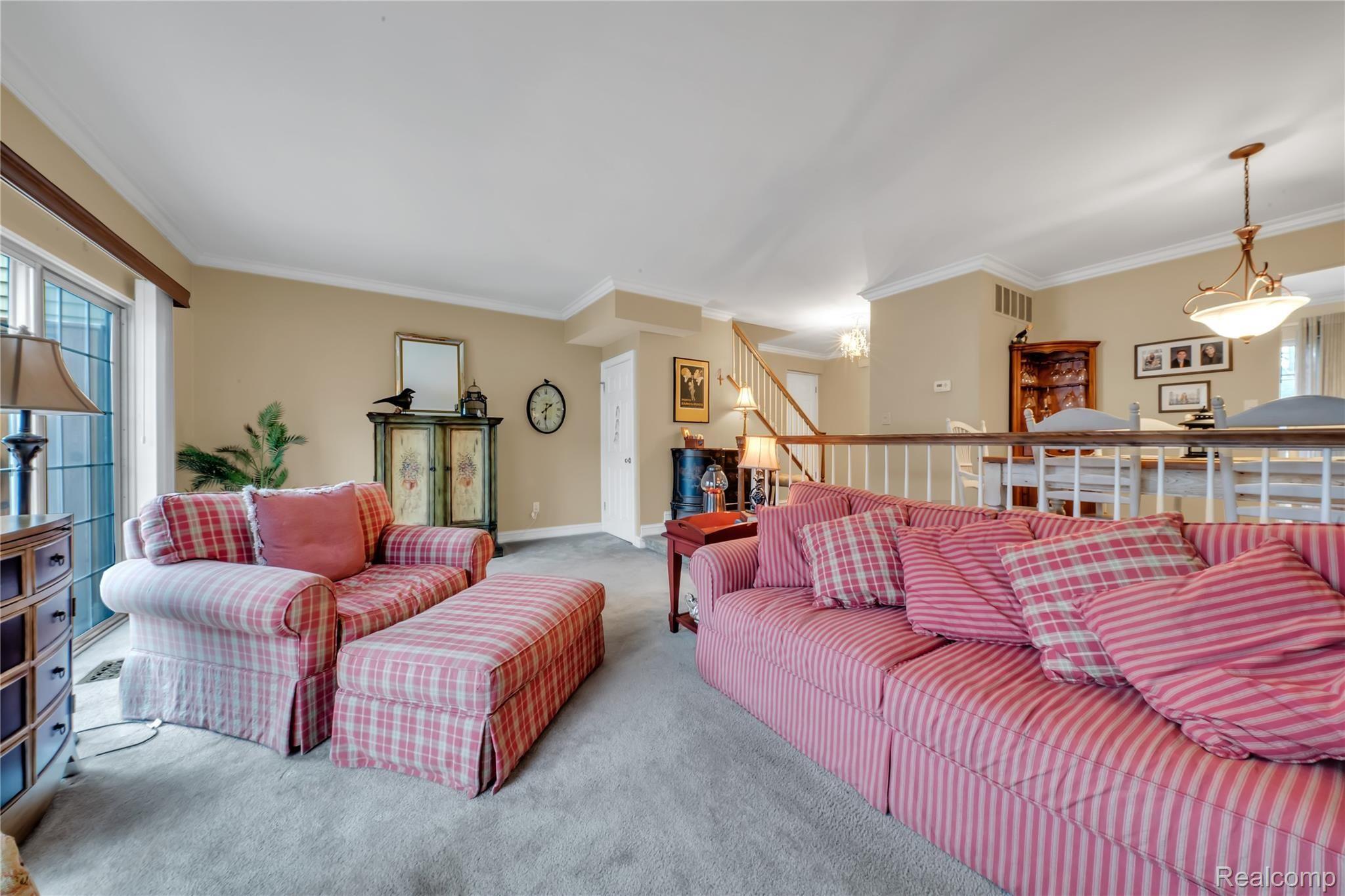 1417 Paddle Wheel Lane, Unit 38 Rochester, MI 48306 - Photo 11 of 29 Family Room area with doorwalls to the rear, outdoor deck.