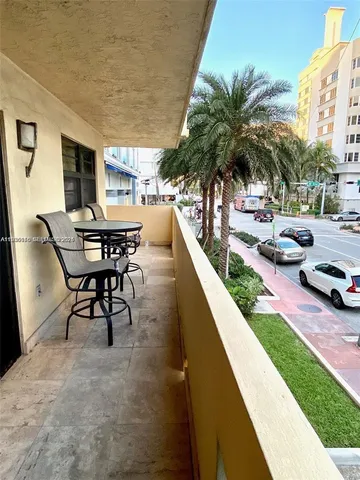 a view of a swimming pool with chairs