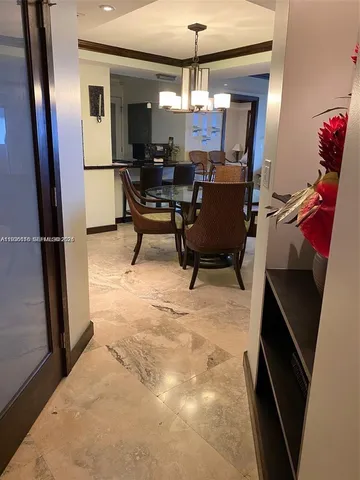 a view of a livingroom with furniture and a ceiling fan