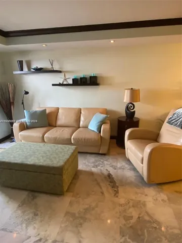 a living room with furniture and a lamp