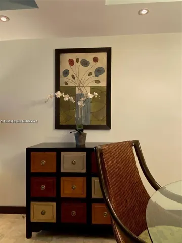 a view of a room with furniture and window