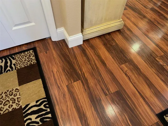 a view of a house with swimming pool and sitting area