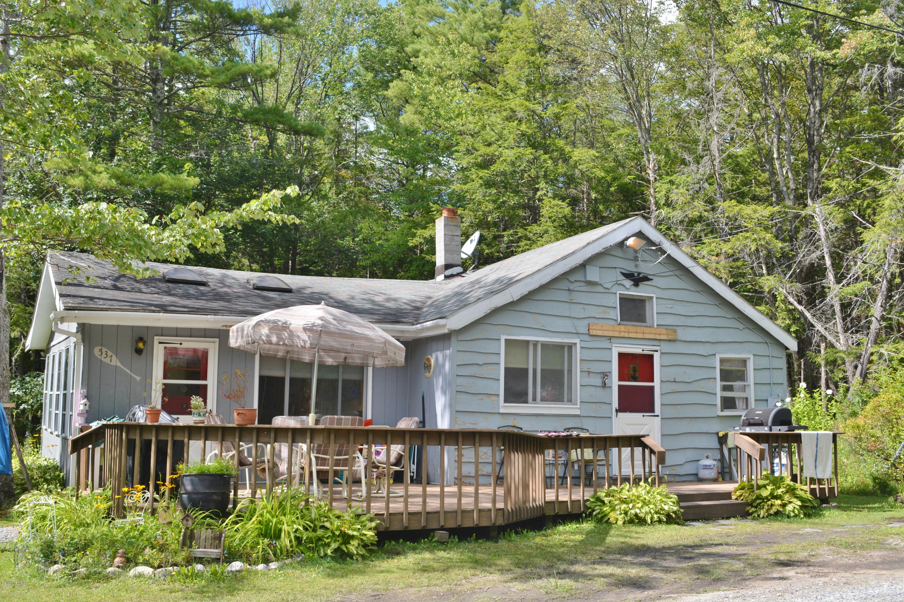 537 Lion Hill Road Otis, MA 01029 - Photo 1 of 6 a front view of a house with garden