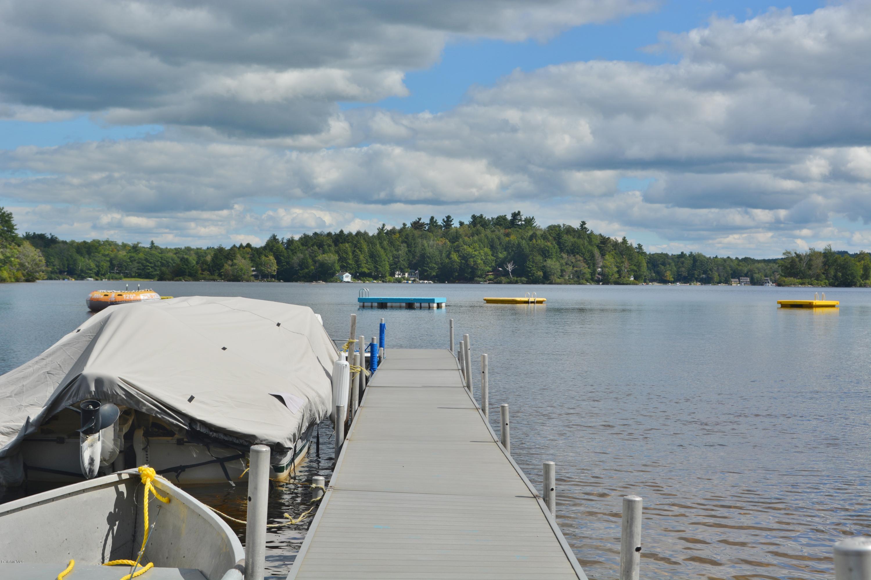 537 Lion Hill Road Otis, MA 01029 - Photo 5 of 6 a view of a lake with a terrace