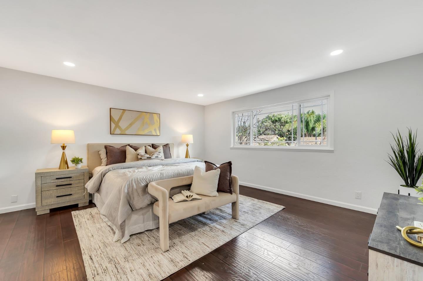 4824 Poston Drive San Jose, CA 95136 - Photo 12 of 33 a bedroom with a bed and a potted plant on the dresser