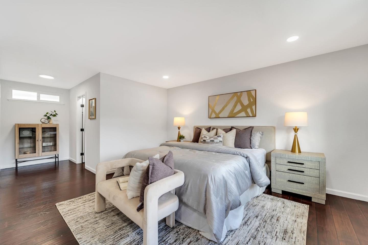 4824 Poston Drive San Jose, CA 95136 - Photo 13 of 33 a spacious bedroom with a bed a couch and a view of kitchen