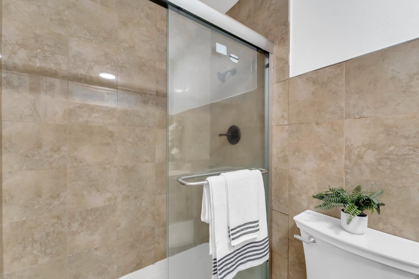 4824 Poston Drive San Jose, CA 95136 - Photo 17 of 33 a bathroom with a shower and a toilet