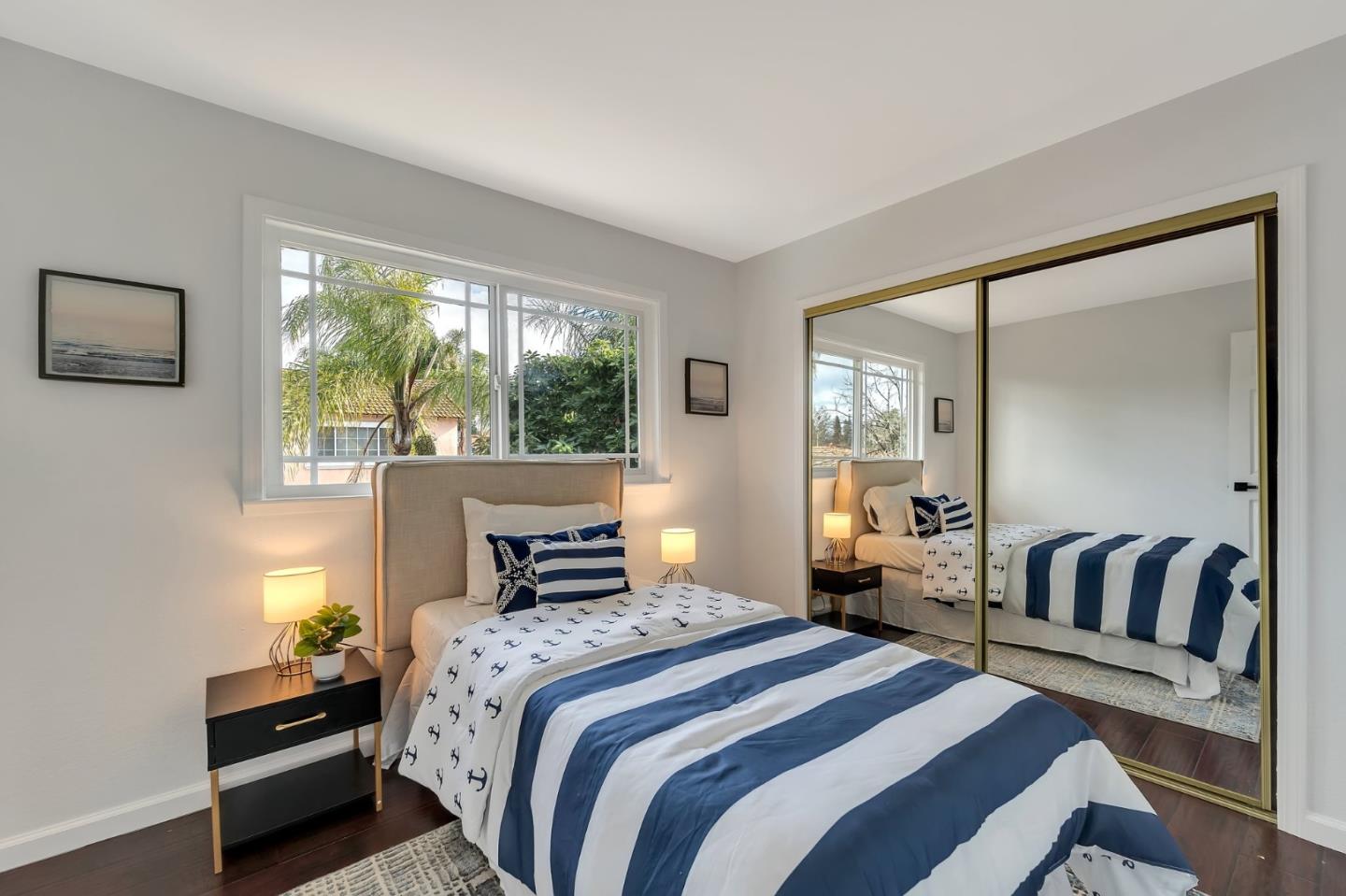 4824 Poston Drive San Jose, CA 95136 - Photo 20 of 33 a bedroom with a large bed and a balcony