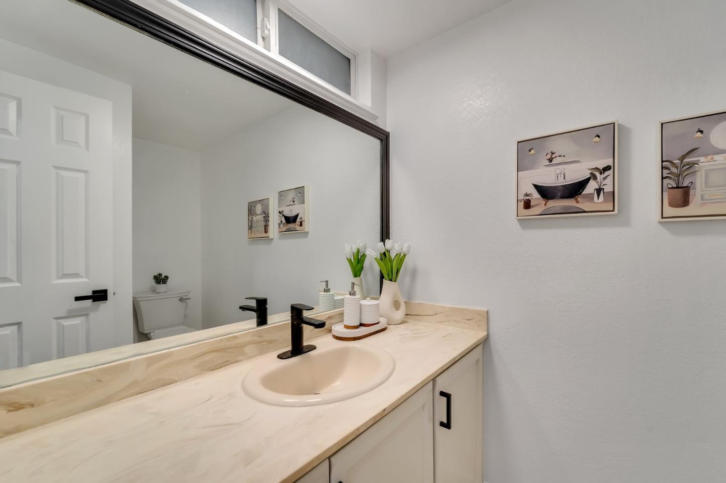 4824 Poston Drive San Jose, CA 95136 - Photo 24 of 33 a bathroom with a sink and a mirror