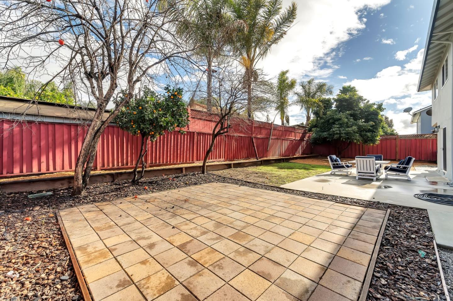 4824 Poston Drive San Jose, CA 95136 - Photo 29 of 33 a view of backyard with wooden fence and large trees
