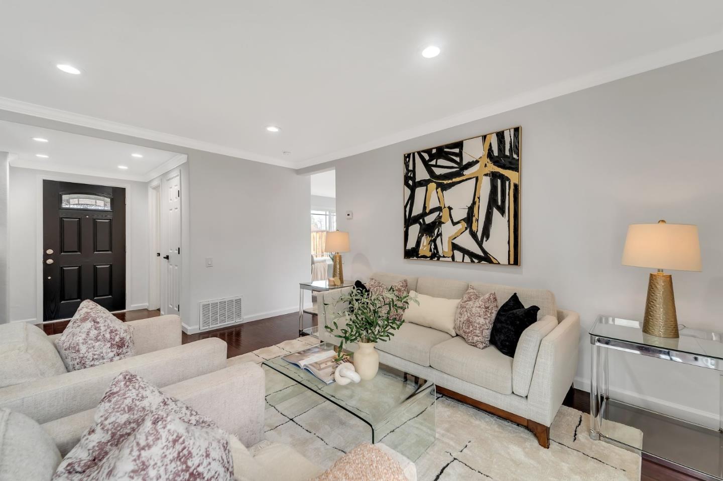 4824 Poston Drive San Jose, CA 95136 - Photo 4 of 33 a spacious bedroom with a bed and couch