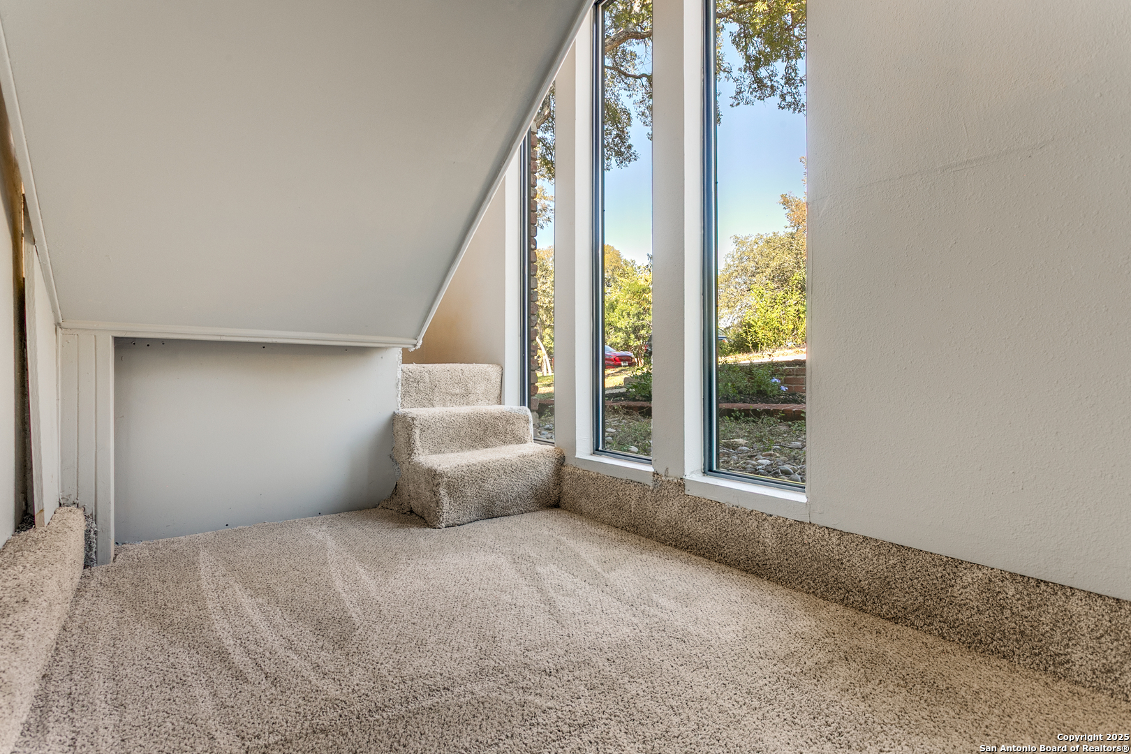 11410 Whisper Moss Street San Antonio, TX 78230 - Photo 11 of 44 a view of an empty room with a window