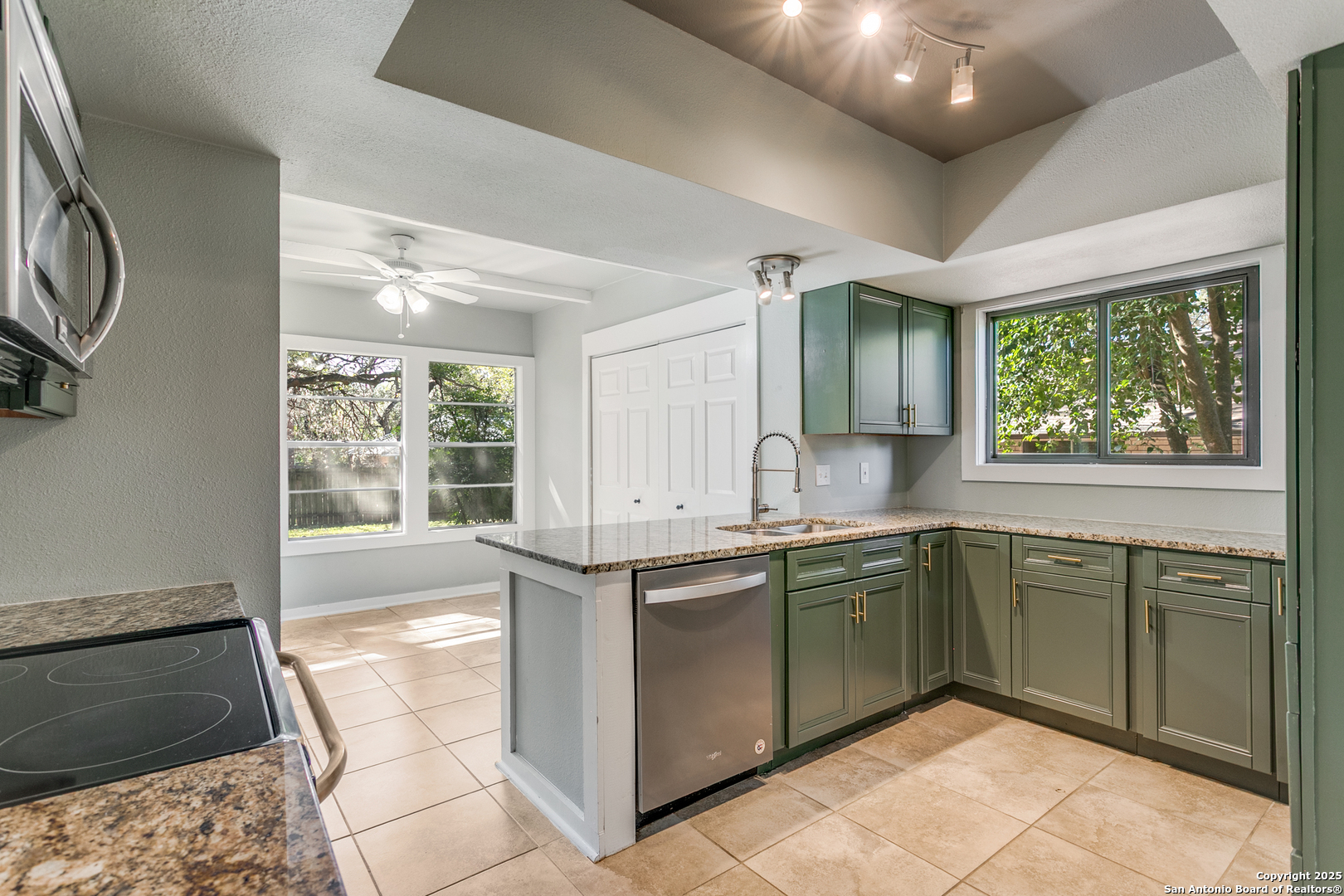 11410 Whisper Moss Street San Antonio, TX 78230 - Photo 18 of 44 a kitchen with a sink and cabinets
