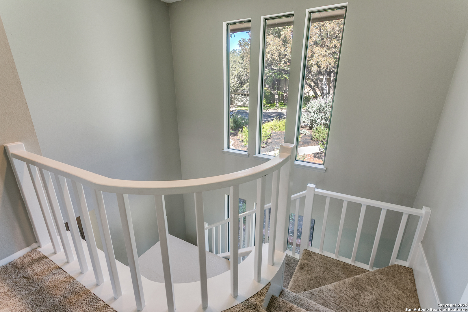 11410 Whisper Moss Street San Antonio, TX 78230 - Photo 23 of 44 a view of entryway with stairs and wooden floor