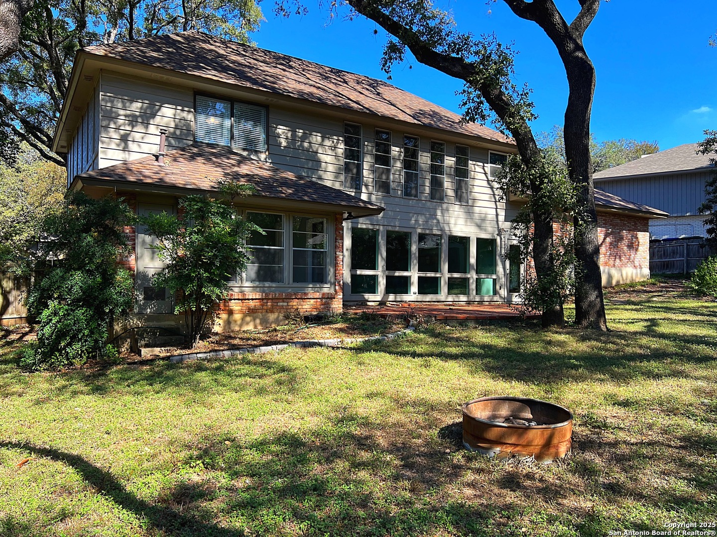 11410 Whisper Moss Street San Antonio, TX 78230 - Photo 32 of 44 a view of a house with swimming pool next to a yard