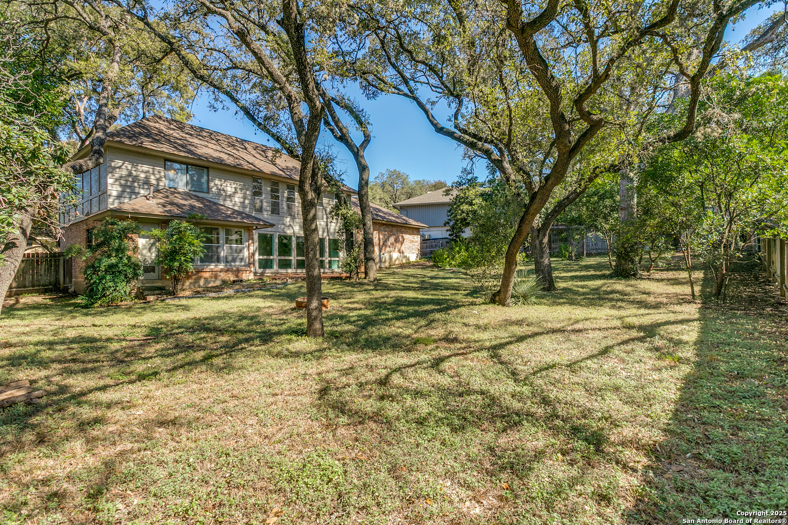11410 Whisper Moss Street San Antonio, TX 78230 - Photo 34 of 44 a view of road with large trees