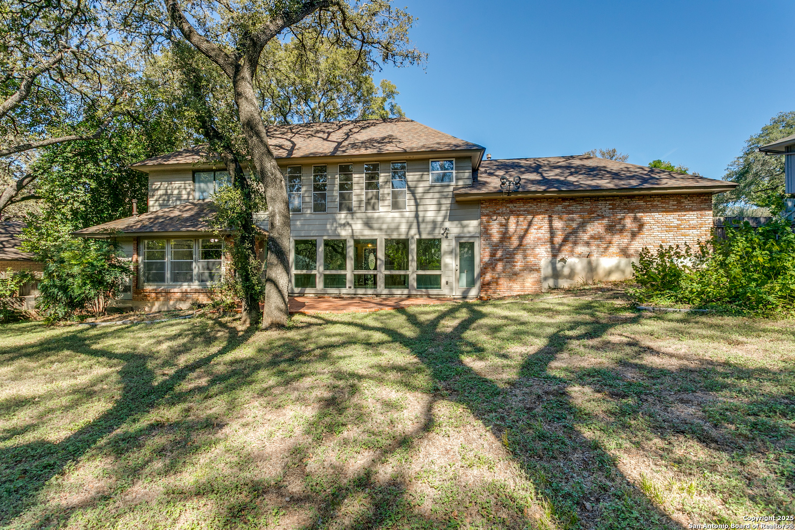 11410 Whisper Moss Street San Antonio, TX 78230 - Photo 35 of 44 a front view of a house with a garden