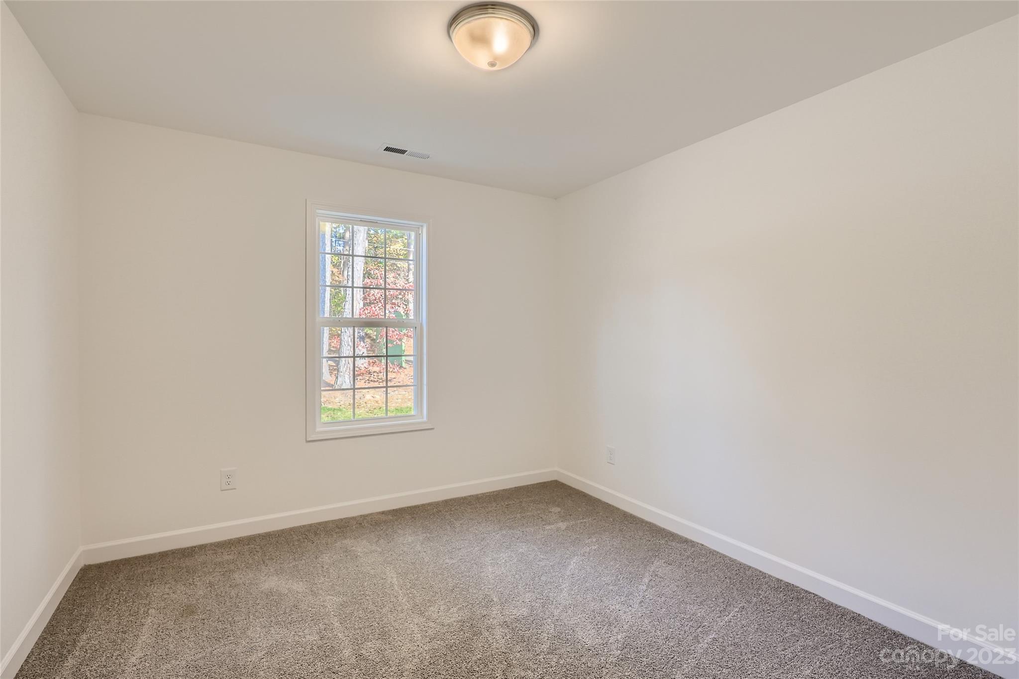 817 North Ransom Street Gastonia, NC 28052 - Photo 6 of 11 an empty room with windows
