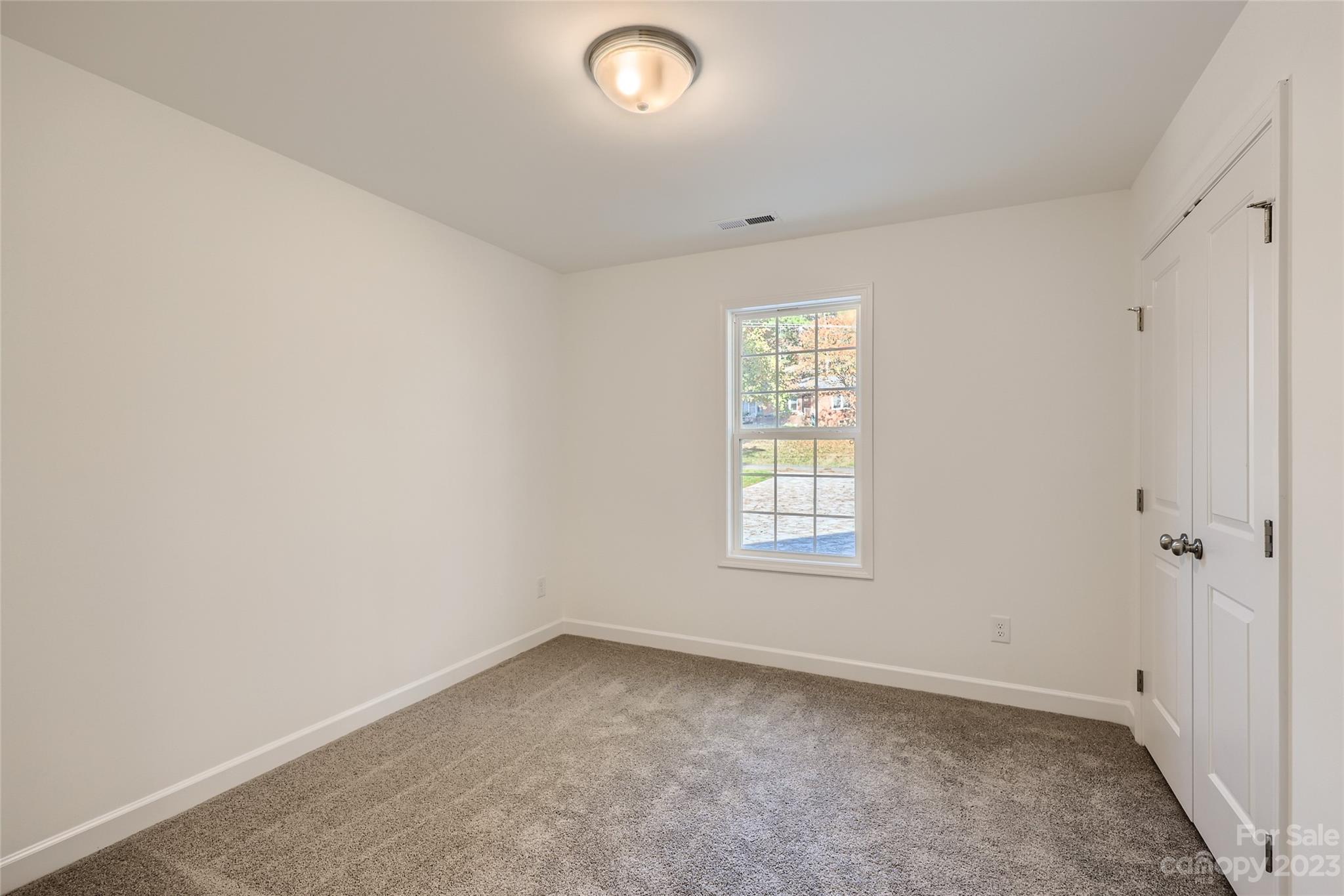 817 North Ransom Street Gastonia, NC 28052 - Photo 8 of 11 an empty room with a window