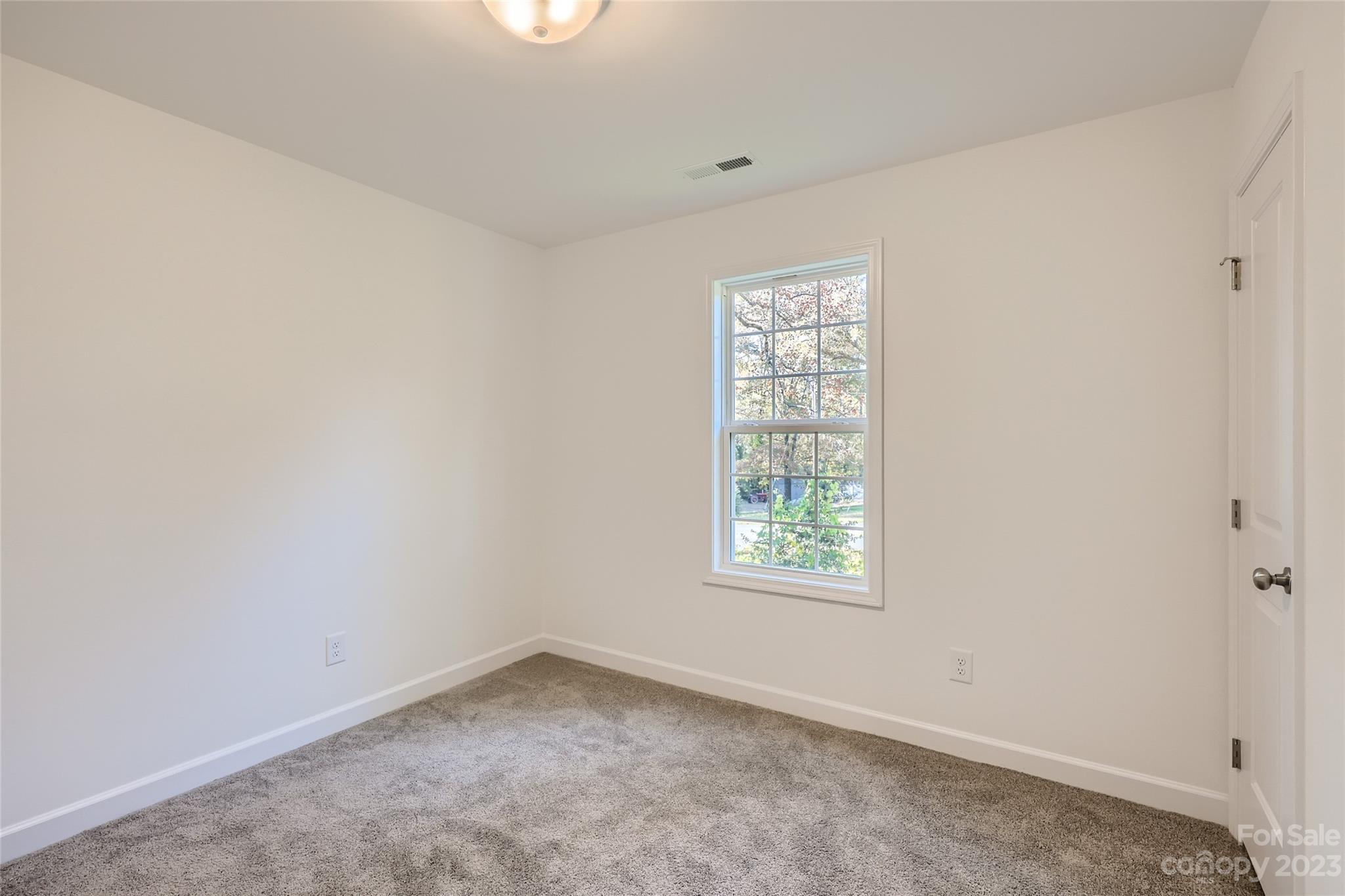 817 North Ransom Street Gastonia, NC 28052 - Photo 9 of 11 an empty room with a window